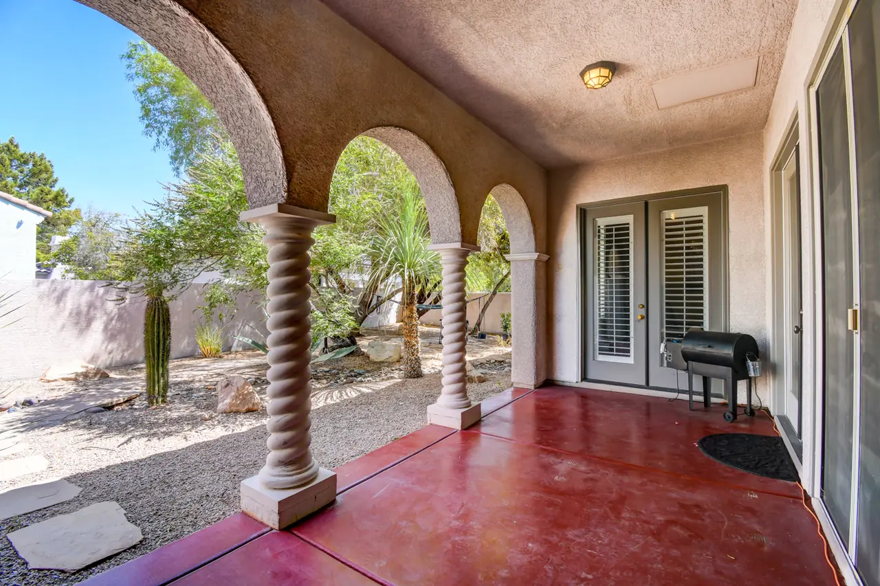 Loggia with twisted columns and arches framing the yard